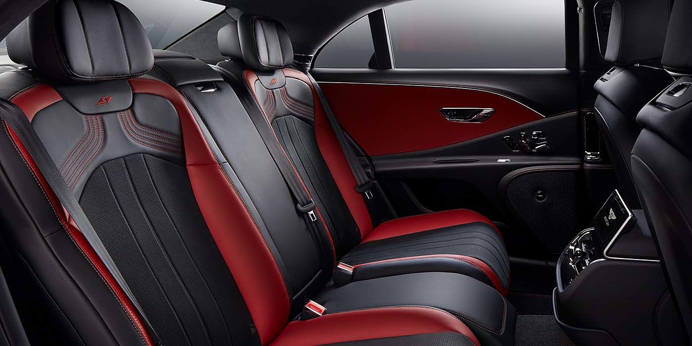 Bentley Suomi Bentley Flying Spur S sedan rear interior in Beluga black and Hotspur red hide with S stitching