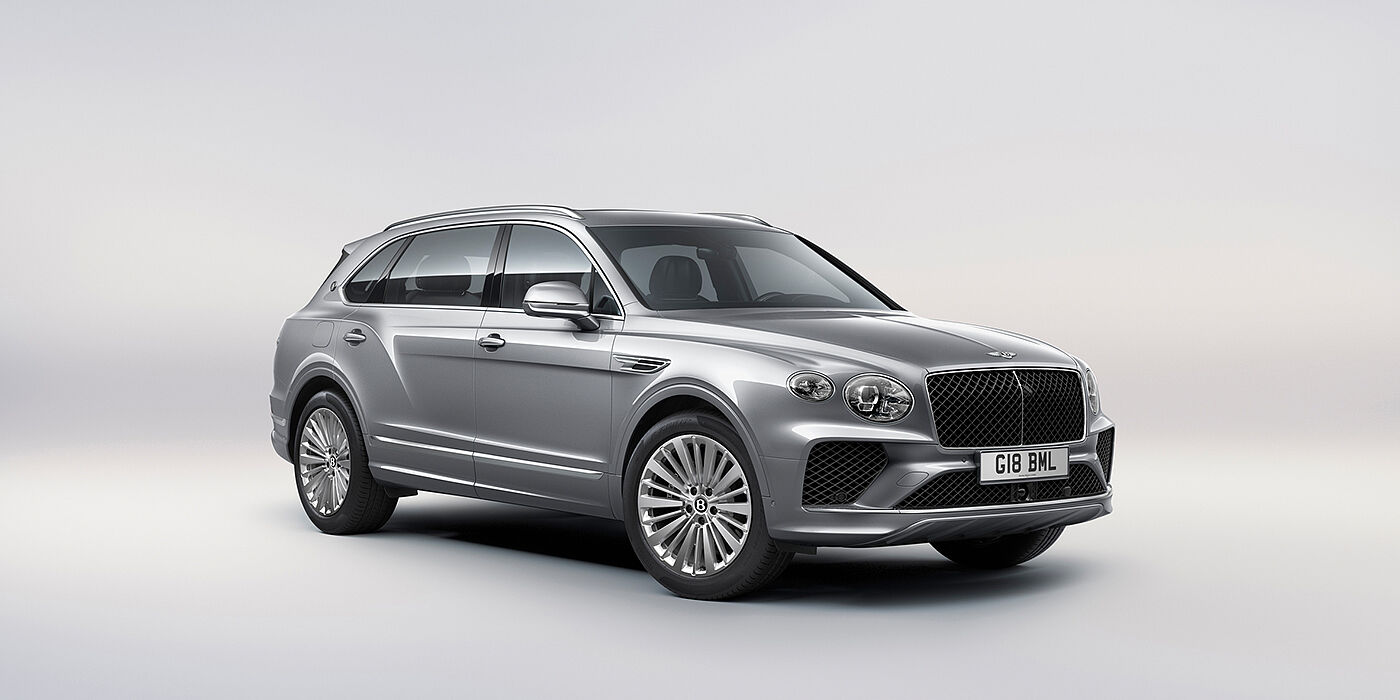 Bentley Suomi Bentley Bentayga Extended Wheelbase luxury SUV front three quarter view in Moonbeam paint with 21 inch five spoke painted wheels