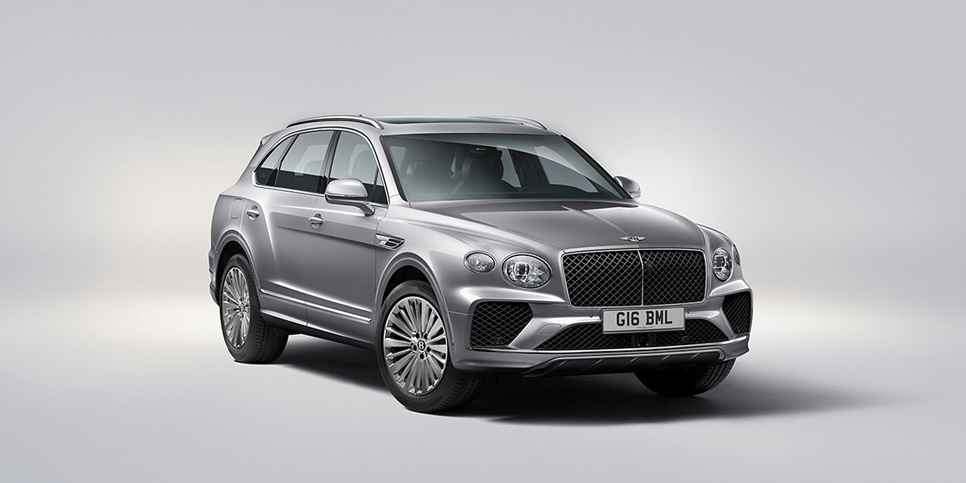 Bentley Suomi Bentley Bentayga luxury SUV front three quarter view in Moonbeam paint with matrix grille and 21″ 5 spoke painted wheels