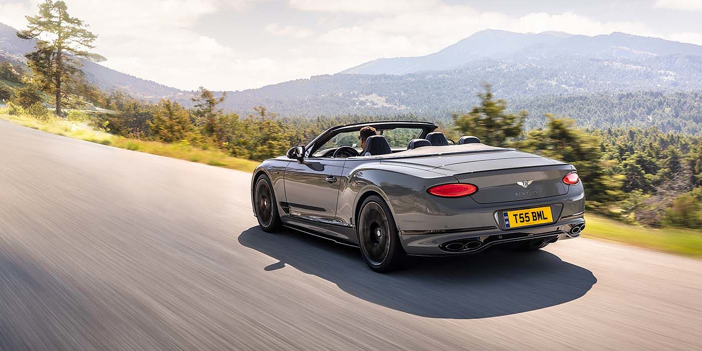 Bentley Suomi Bentley Continental GTC S convertible in Cambrian Grey paint rear 34 dynamic driving