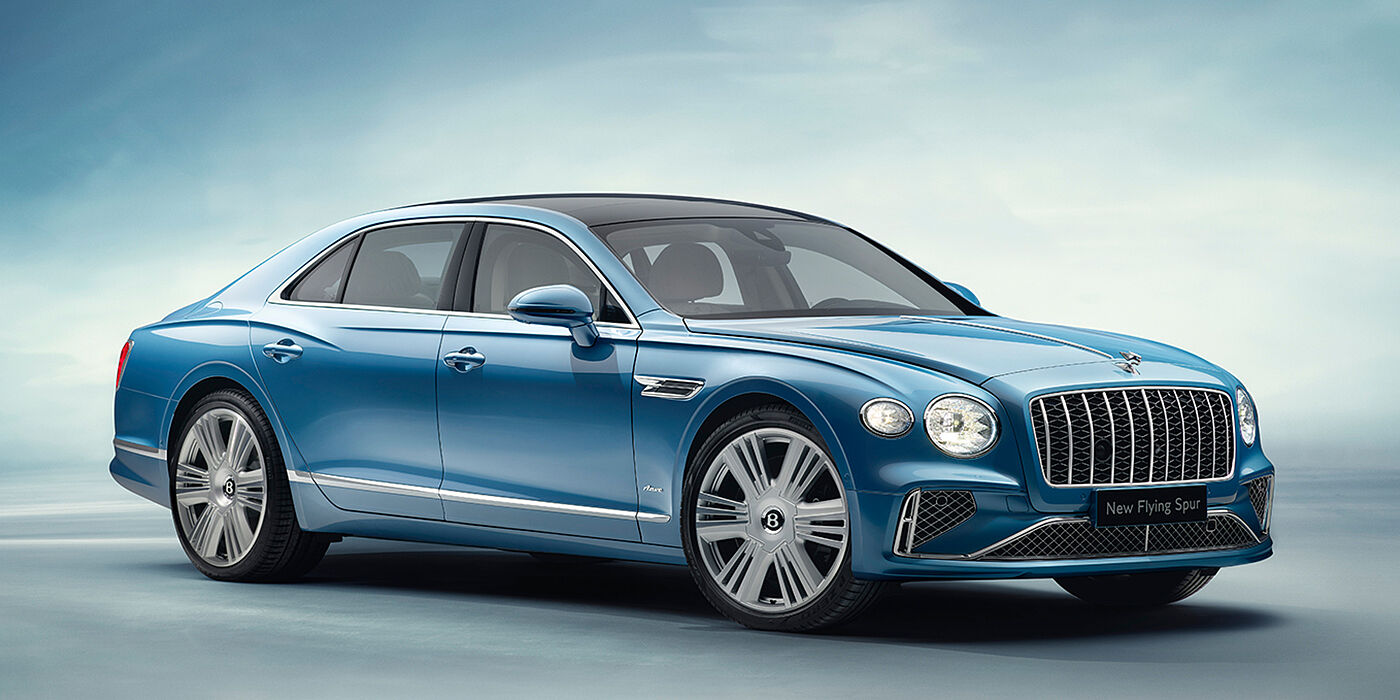 Bentley Suomi New Bentley Flying Spur Azure sedan front view in Light windsor blue by Mulliner paint with 22 inch Azure wheels and chrome exterior details