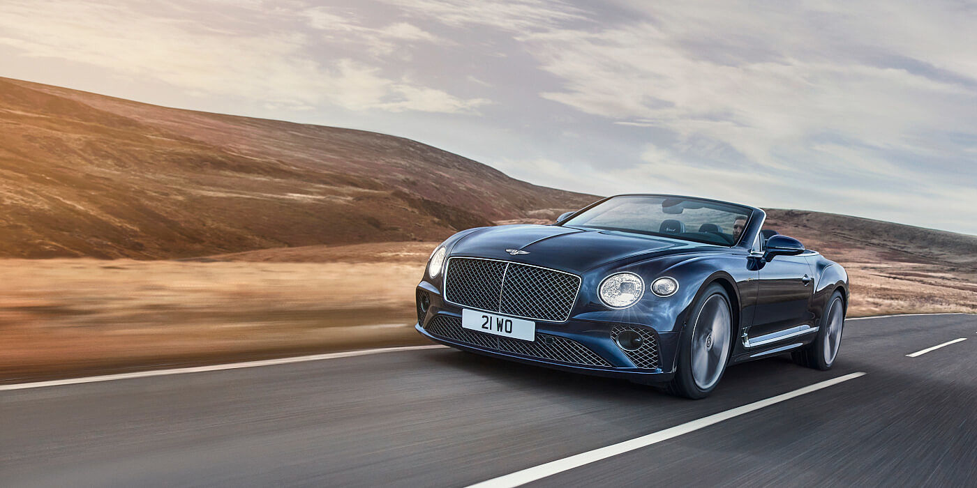 Bentley Suomi Bentley Continental GTC Speed convertible in Peacock paint side front 34 dynamic