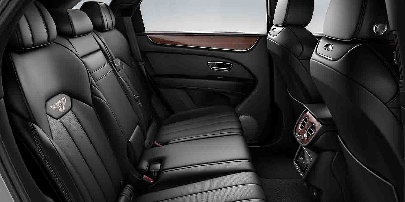 Bentley Suomi Bentley Bentayga EWB interior view for rear passengers with Beluga black hide.