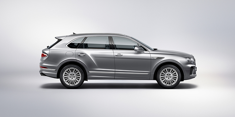 Bentley Suomi Bentley Bentayga SUV side profile in Moonbeam silver paint against white background featuring 21 inch 5 spoke wheels