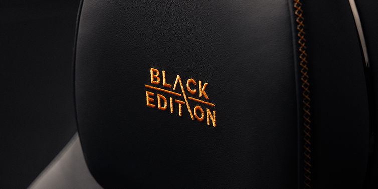 Bentley Suomi Bentley Continental GT coupe seat headrest Black Edition stitched emblem in Mandarin colour against Beluga black hide